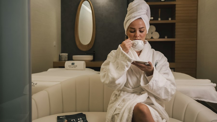 Woman in a robe relaxing at a spa